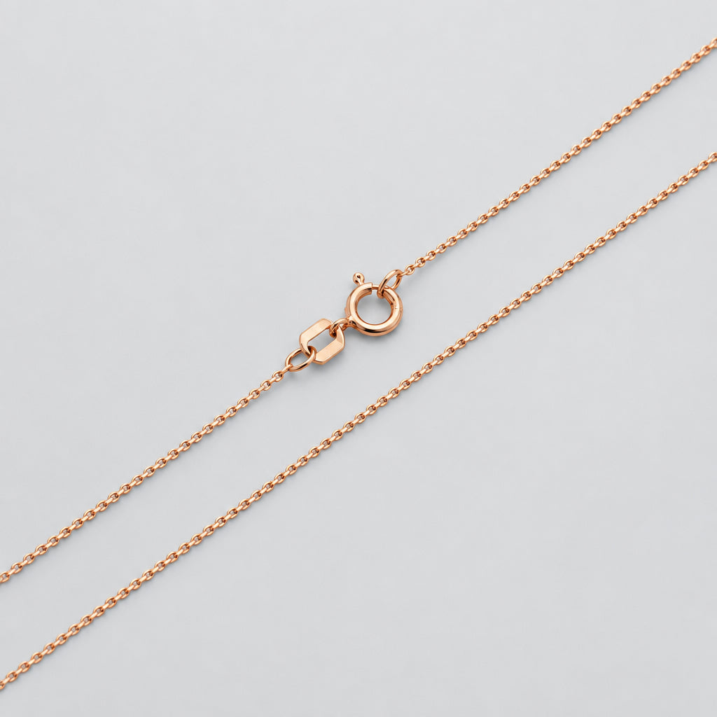 Rose gold chain necklace on a white background