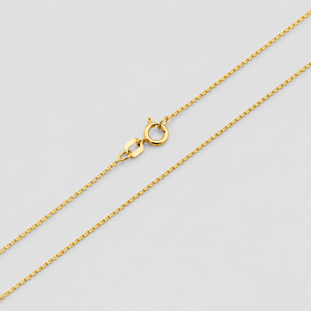 Gold chain necklace on a white background