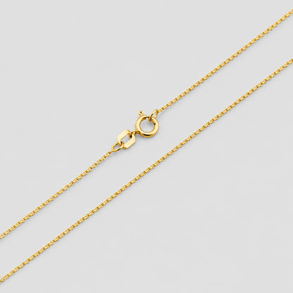 Gold chain necklace on a white background