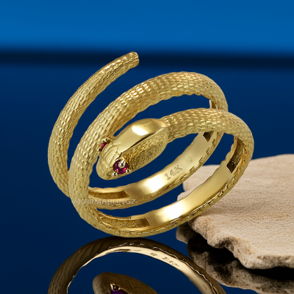 Textured yellow gold coiled snake wrap ring with ruby eyes; available in 10K or 14K.
