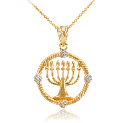 Gold pendant necklace featuring a menorah inside a circular frame with twisted rope detailing and four small clear stones, shown on a white background.