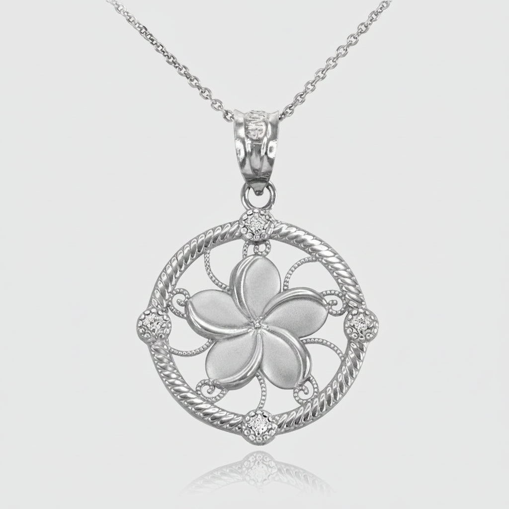 A silver-tone plumeria flower pendant necklace on a delicate chain, set against a clean white background with a subtle reflection below.
