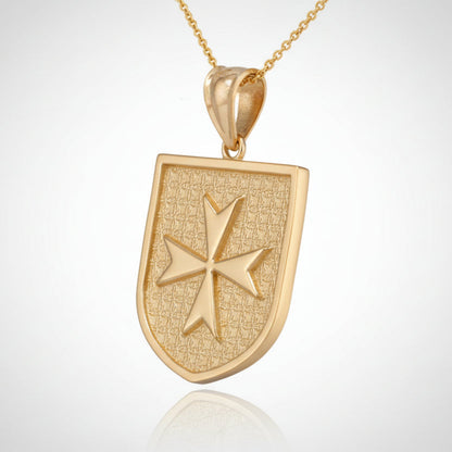 Gold pendant with a shield design and star emblem on a white background