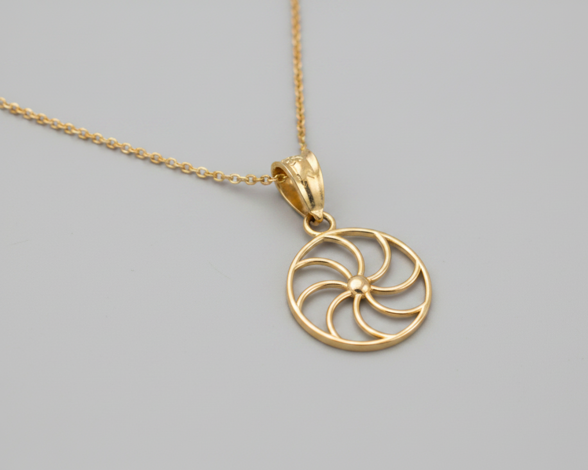Gold pendant with a black background