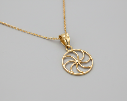Gold pendant with a black background