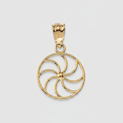 Gold pendant with a circular design on a white background