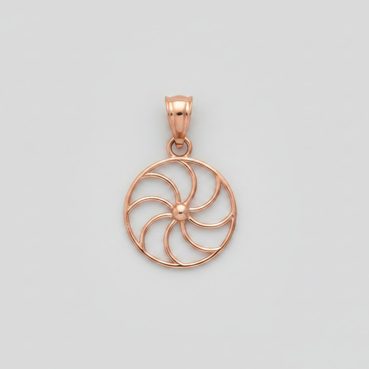 Rose gold circular pendant on a white background