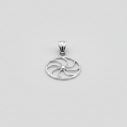 Silver pendant with a circular design on a white background
