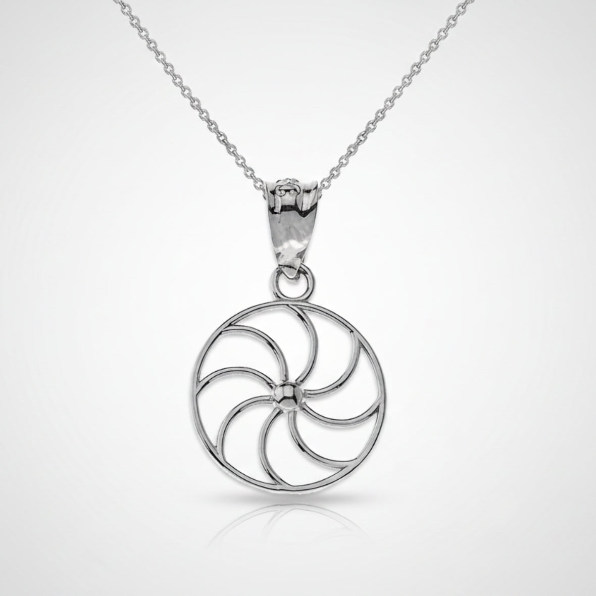 Silver circular pendant necklace on a white background