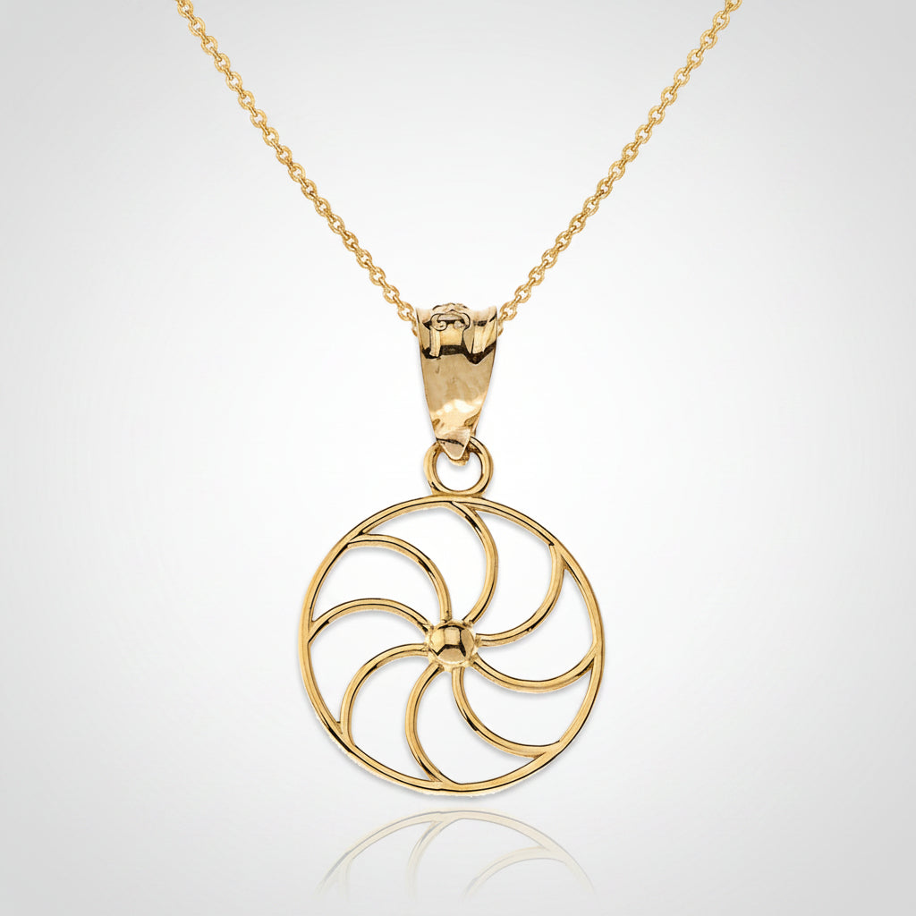 Gold necklace with a circular pendant on a white background