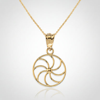 Gold necklace with a circular pendant on a white background