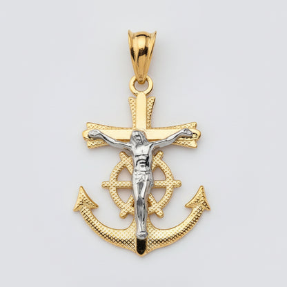 Gold pendant with anchor design and crucifixion figure on a white background