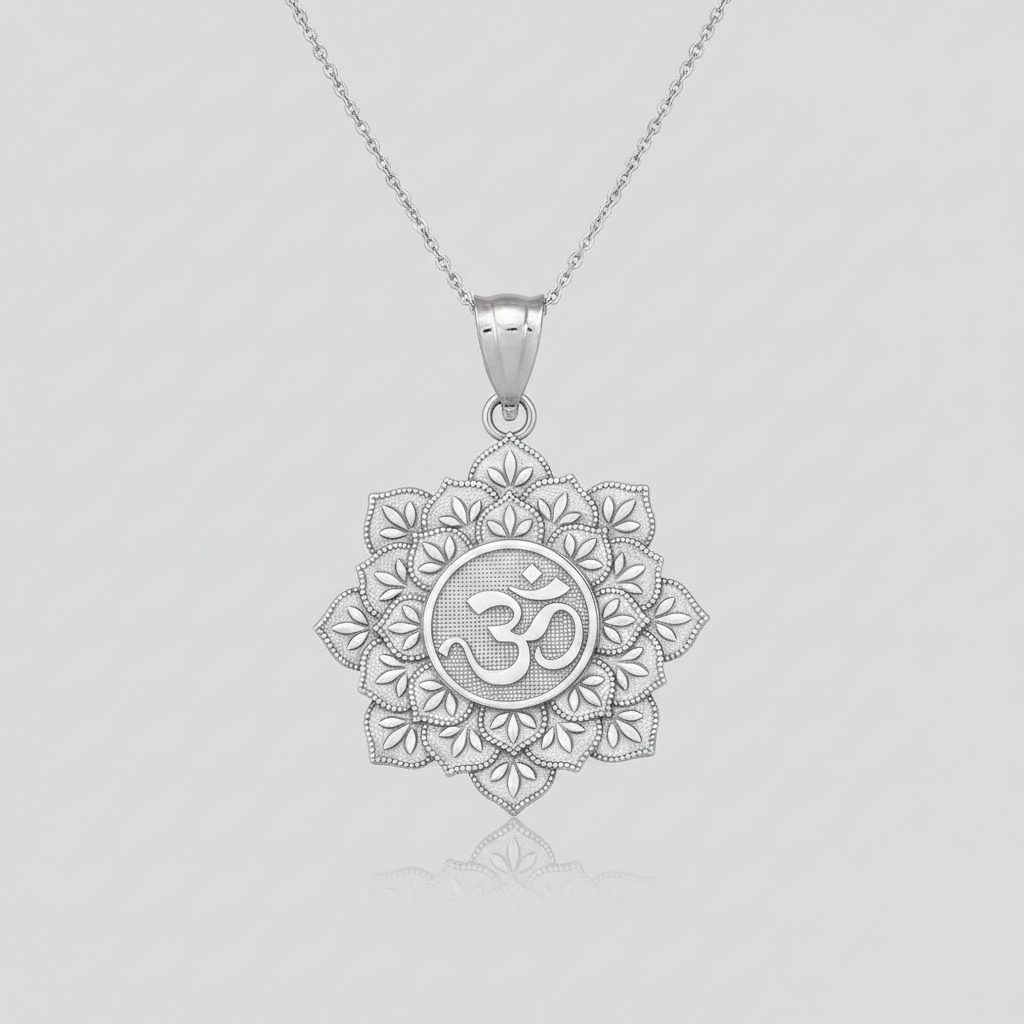A silver pendant necklace featuring a detailed lotus flower design with an Om symbol in the center, suspended from a delicate silver chain against a light gray background.