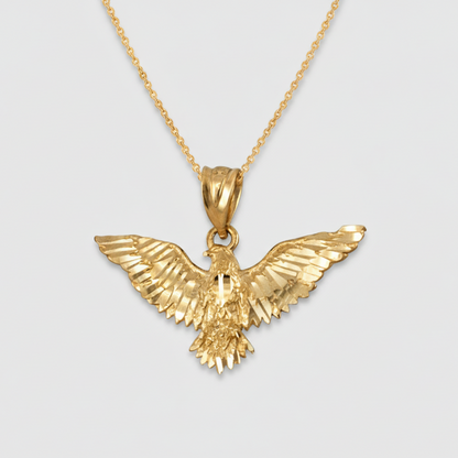 Gold eagle pendant on a gold chain necklace