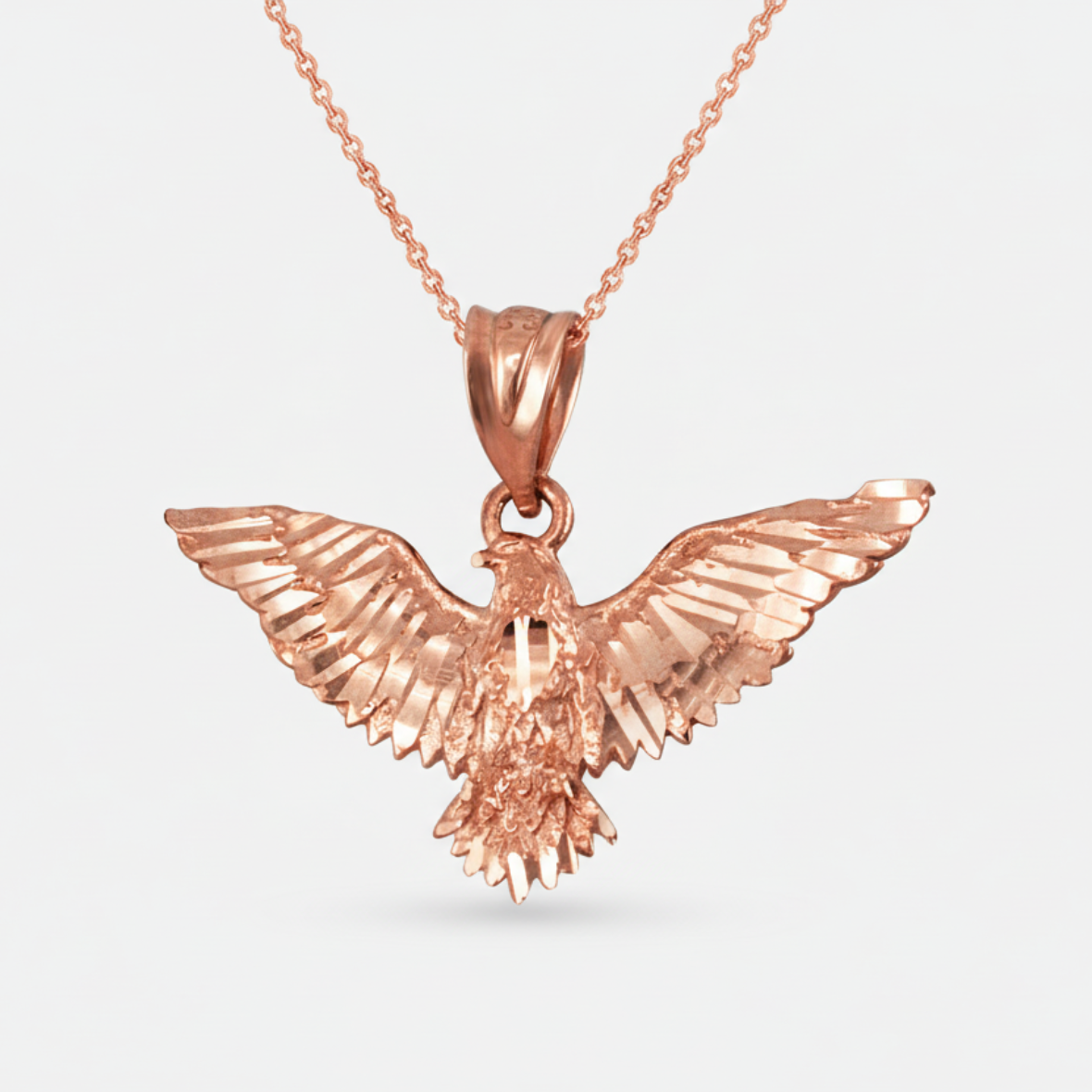 Rose gold eagle pendant on a chain necklace