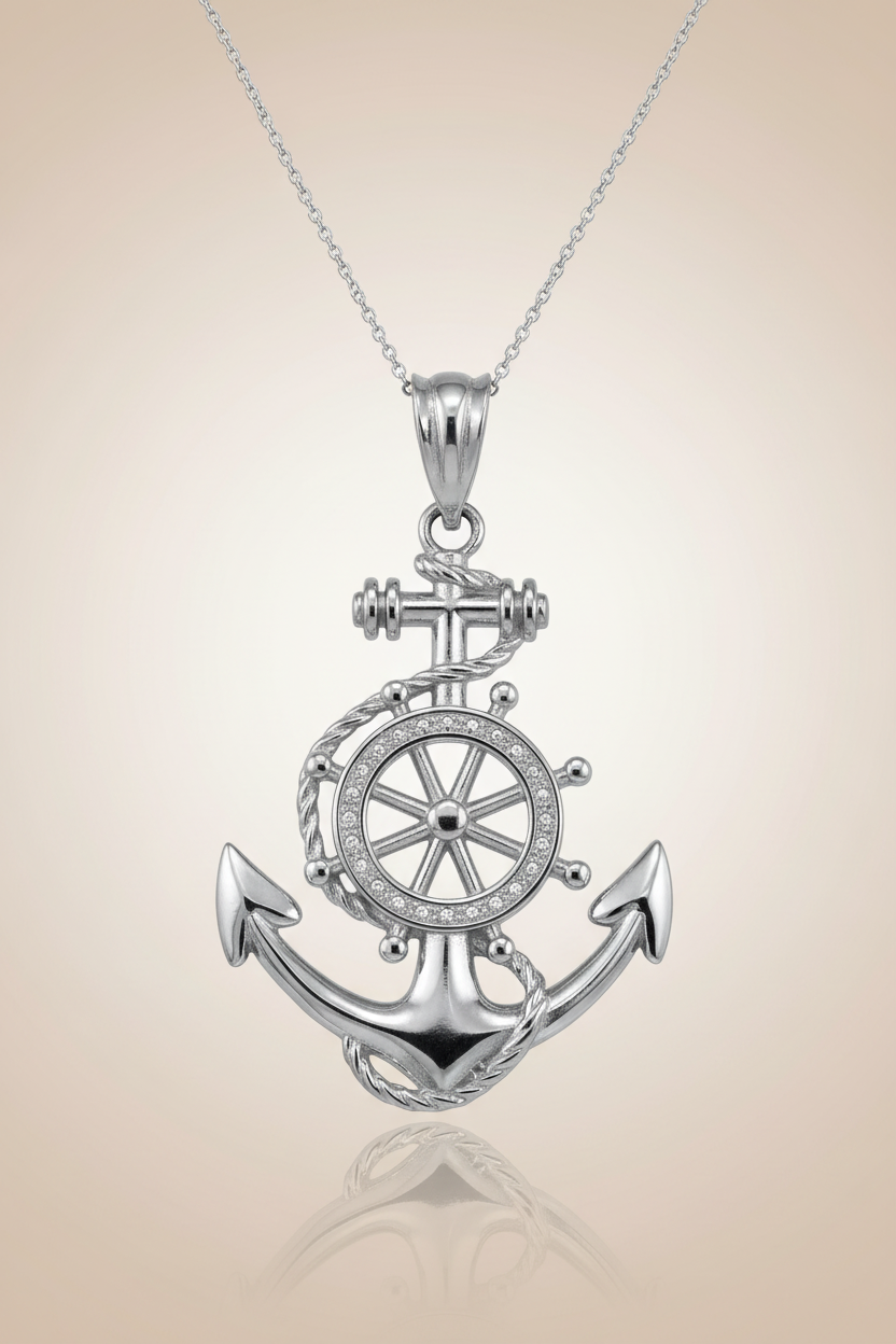 Silver anchor and wheel pendant on a beige background