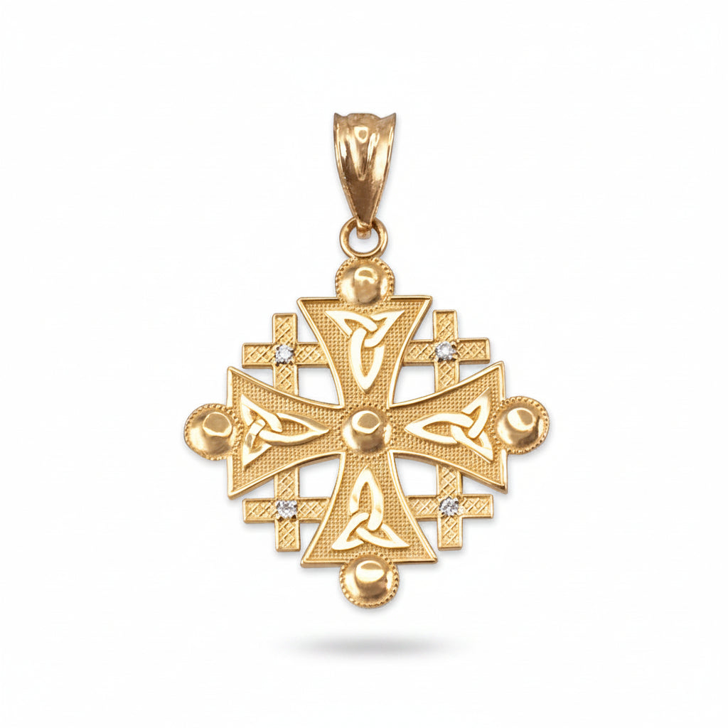 A gold jerusalem cross pendant featuring intricate knotwork and triquetra designs, accented with small clear stones, shown on a plain white background.