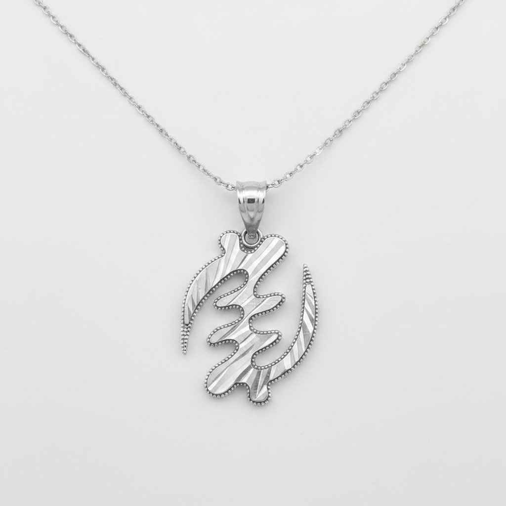 A silver pendant necklace featuring a stylized, abstract calligraphic design with textured striations and a beaded border, suspended from a delicate silver chain against a light gray background.