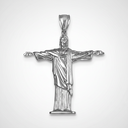 Silver pendant of a religious figure on a white background