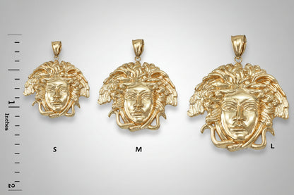 Three gold face-shaped pendants with a size comparison scale on a white background. 3 different sizes. leveled on top