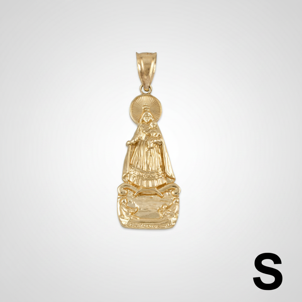Gold pendant with religious figure on a white background with measurement scale.