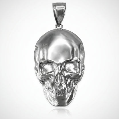 Silver skull pendant on a white background