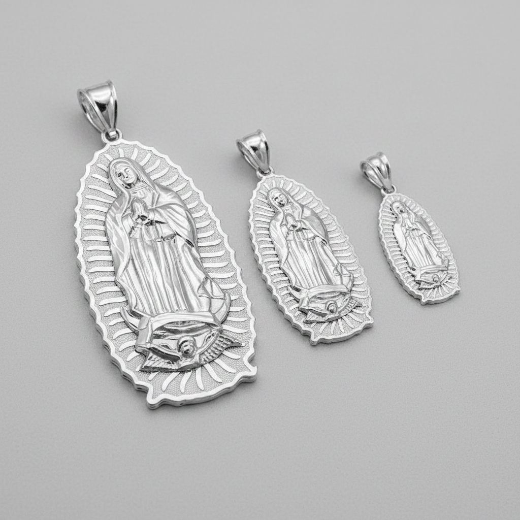 Set of three silver religious pendants on a gray background