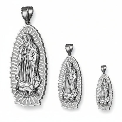 Set of three silver religious pendants on a white background