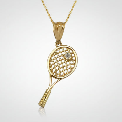 Gold tennis racket pendant with a white sparkling diamond