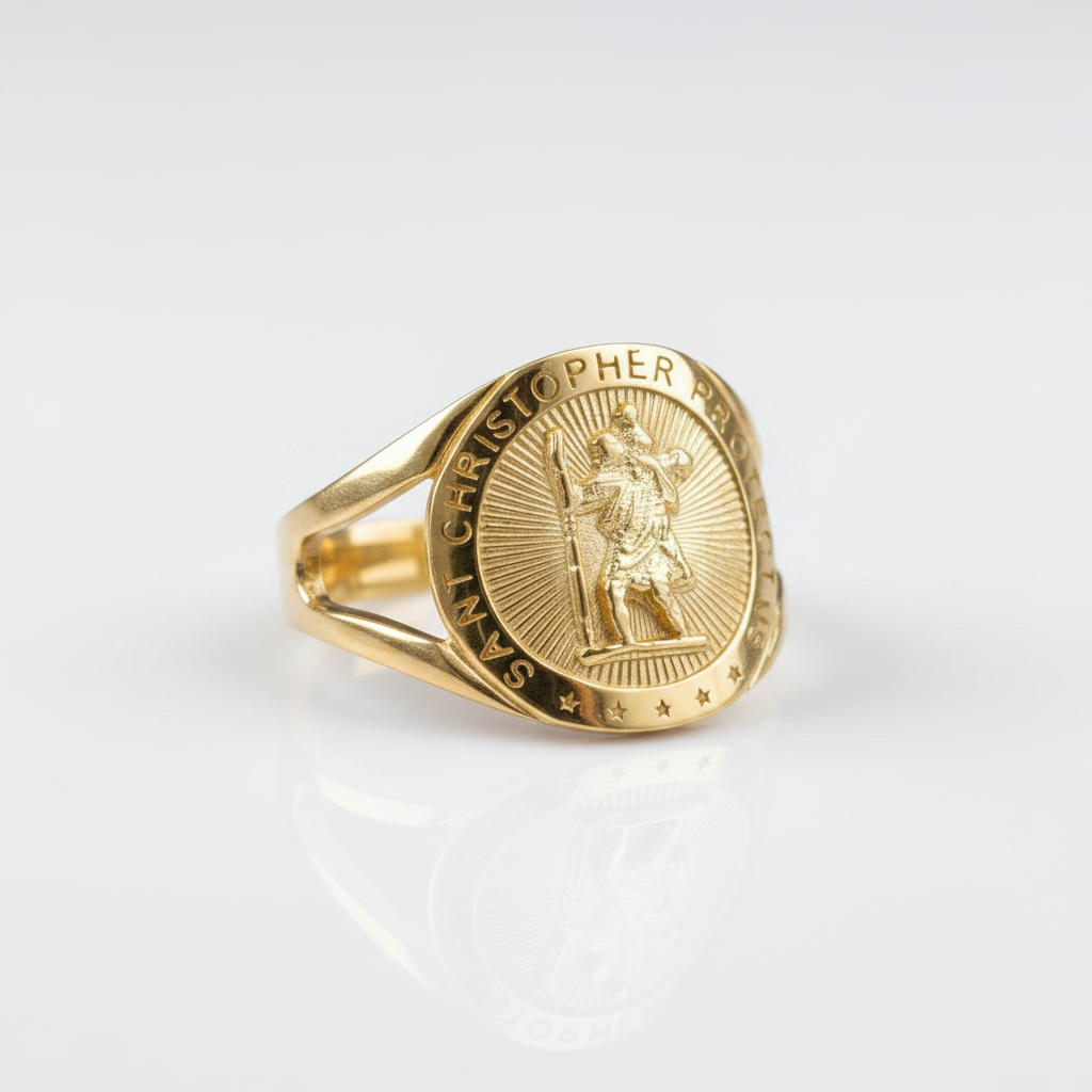 A gold signet ring featuring an embossed Saint Christopher design on a polished white background with a soft reflection.