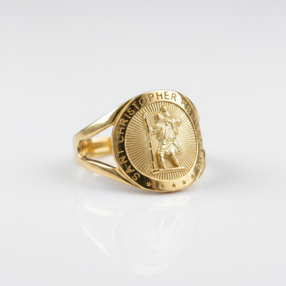 A gold signet ring featuring an embossed Saint Christopher design on a polished white background with a soft reflection.