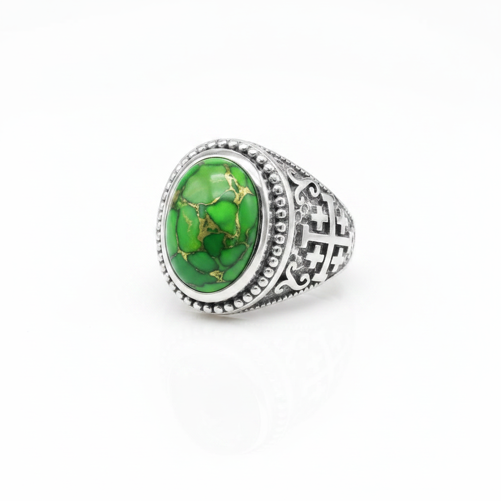 A silver-toned signet ring featuring an oval green stone with natural gold veining, set against a clean white background.