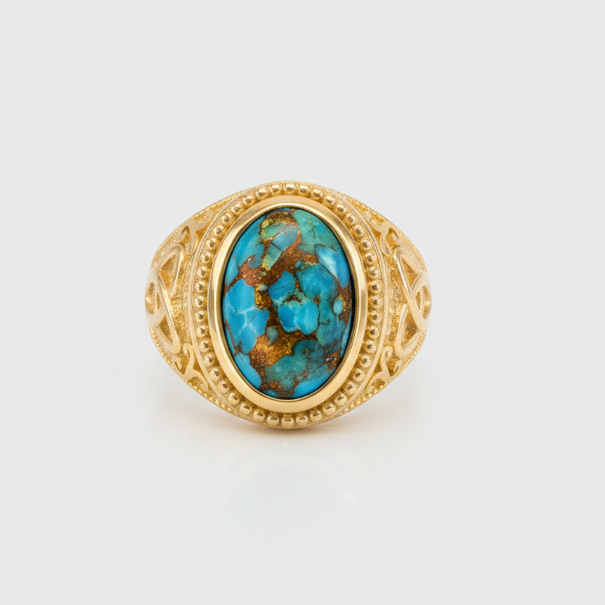 Gold ring with a turquoise stone on a white background