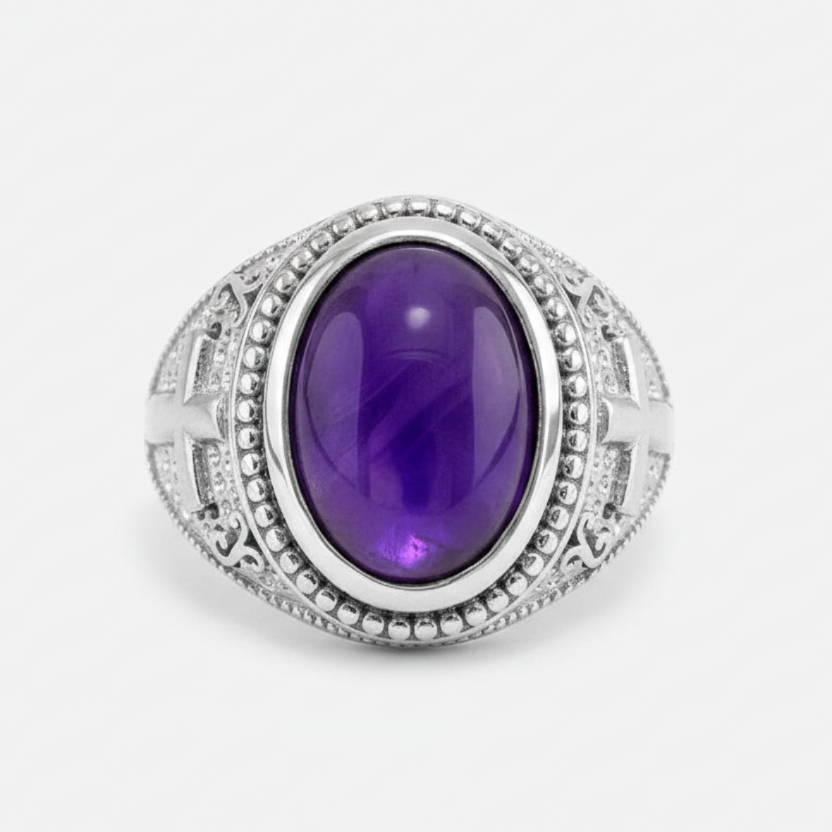 Silver ring with a purple gemstone on a white background