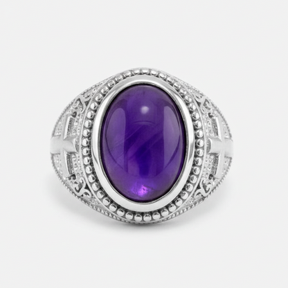 Silver ring with a purple gemstone on a white background