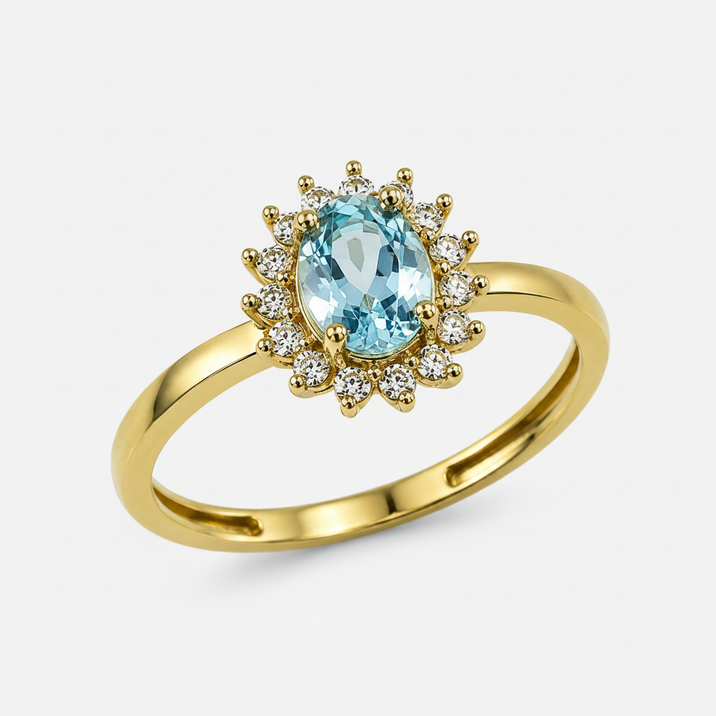 A yellow gold ring featuring an oval light aquamarine center stone surrounded by a halo of small clear cubic zirconia stones, set against a plain white background.