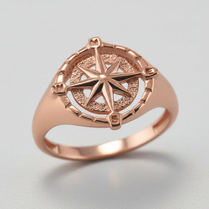 Rose gold ring with compass design