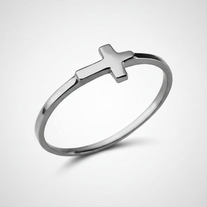 Silver ring with a cross on a white background
