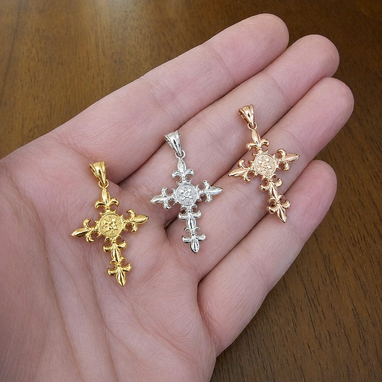 Karma Blingz yellow, white, and rose gold fleur de lis cross pendants with polished finish and textured center detail.