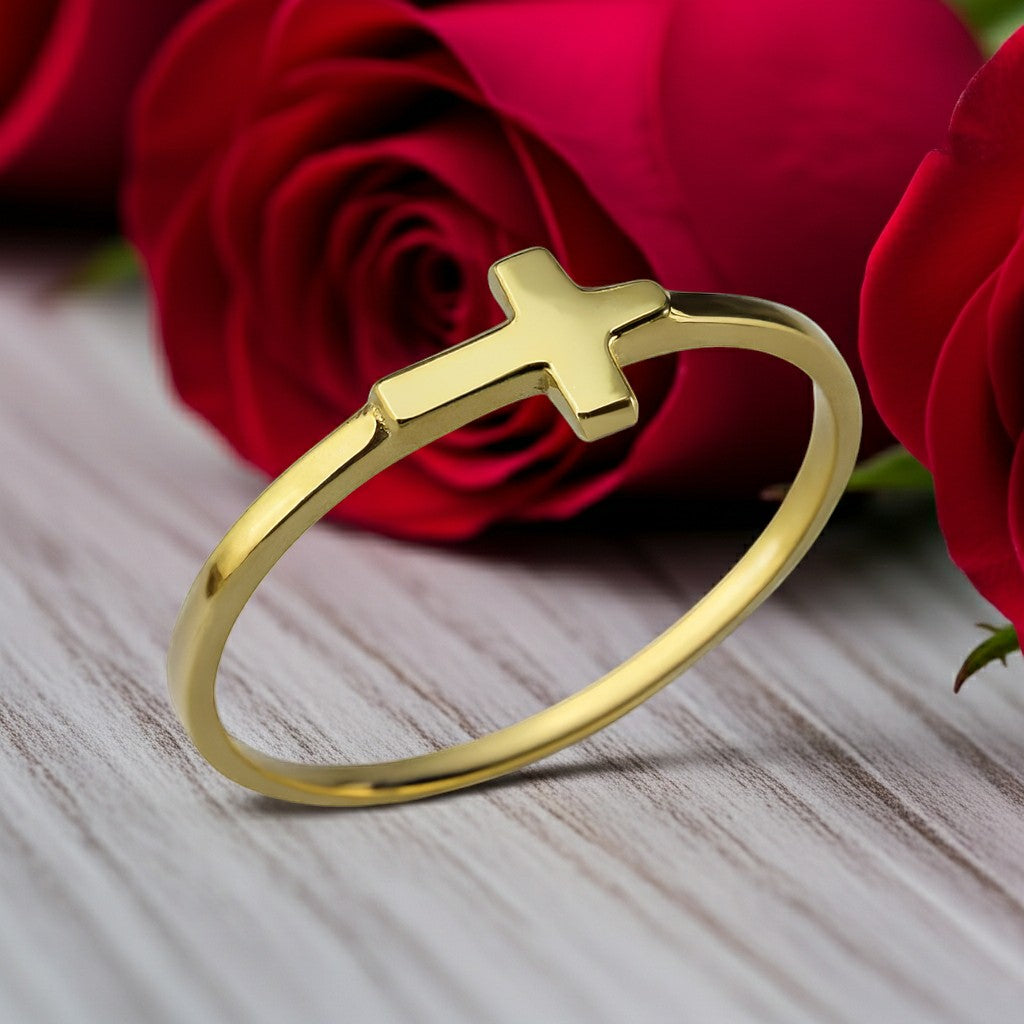 Karma Blingz gold sideways cross stacking ring for women, dainty faith jewelry in polished yellow gold.