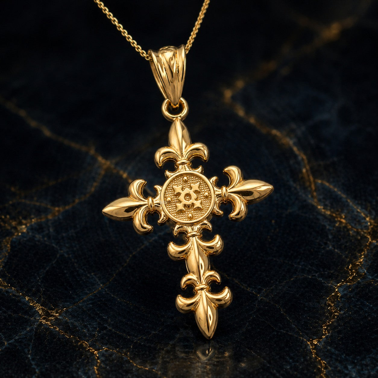 Karma Blingz yellow gold fleur de lis cross pendant necklace with polished finish and textured center detail.