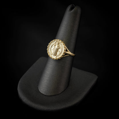 Karma Blingz yellow gold St. Benedict coin medallion ring for women, featuring a detailed Saint Benedict image and intricate detailing around the coin.