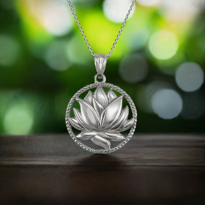 Karma Blingz polished sterling silver lotus flower pendant necklace with beaded circle detail, symbolizing yoga and mindfulness.