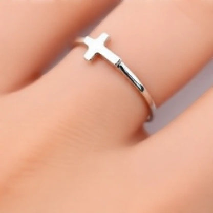 Karma Blingz white gold sideways cross minimalist stacking ring for women, dainty faith jewelry.