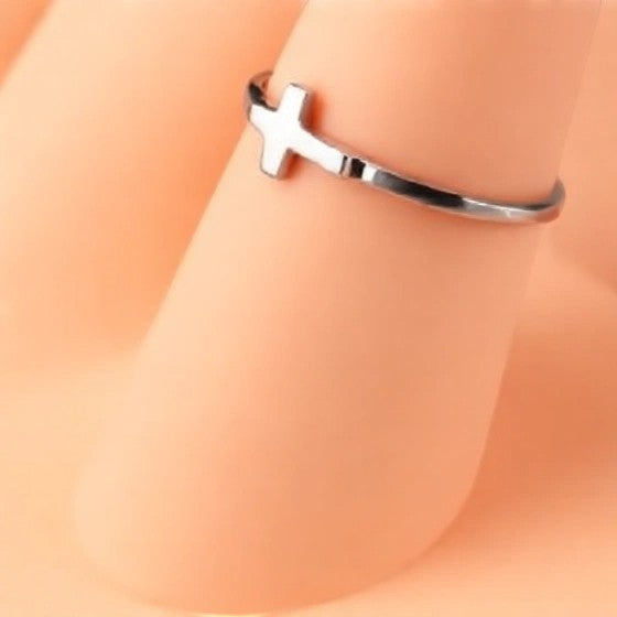 Karma Blingz white gold sideways cross stacking ring for women, dainty faith jewelry.