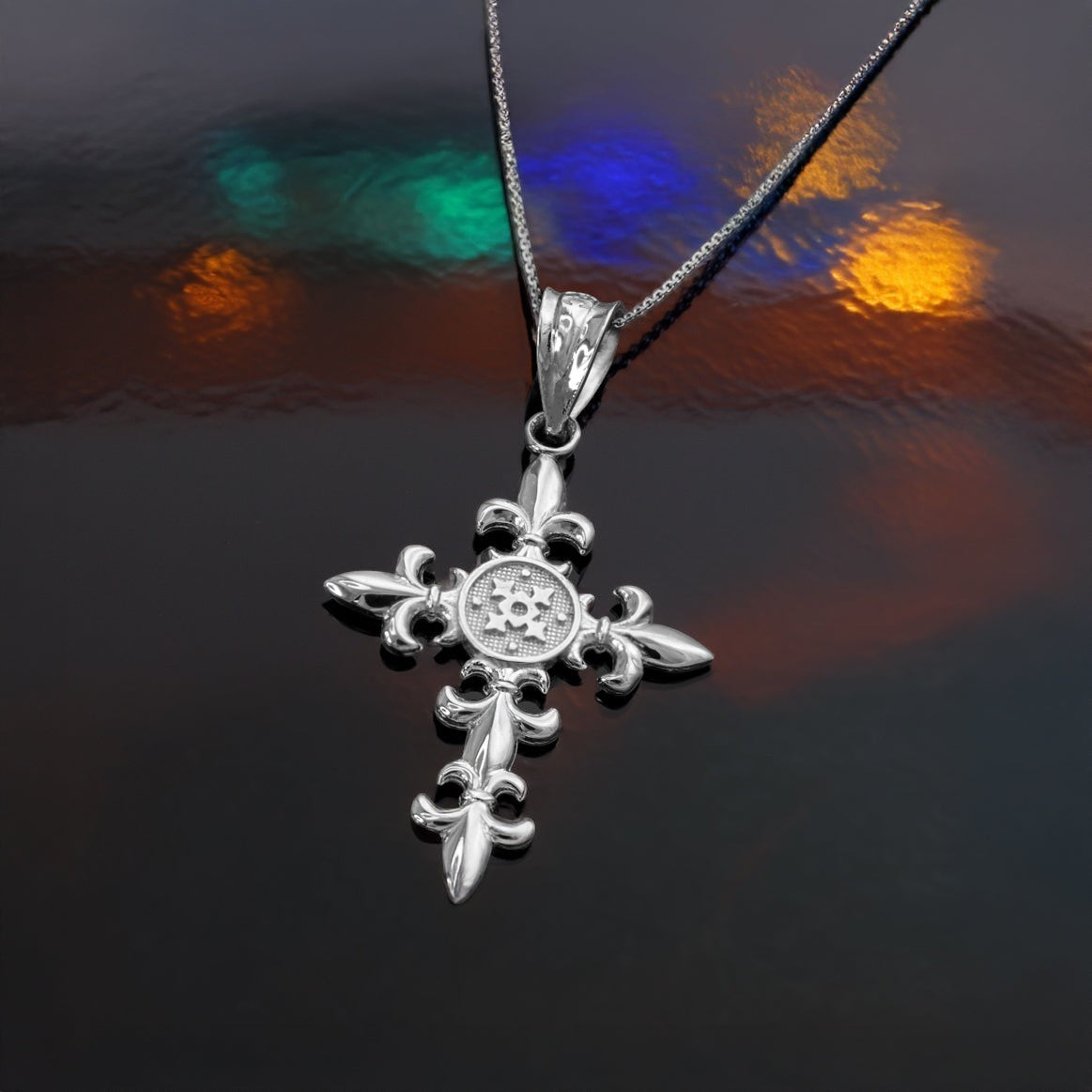 Karma Blingz white gold fleur de lis cross pendant necklace with polished finish and textured center detail.