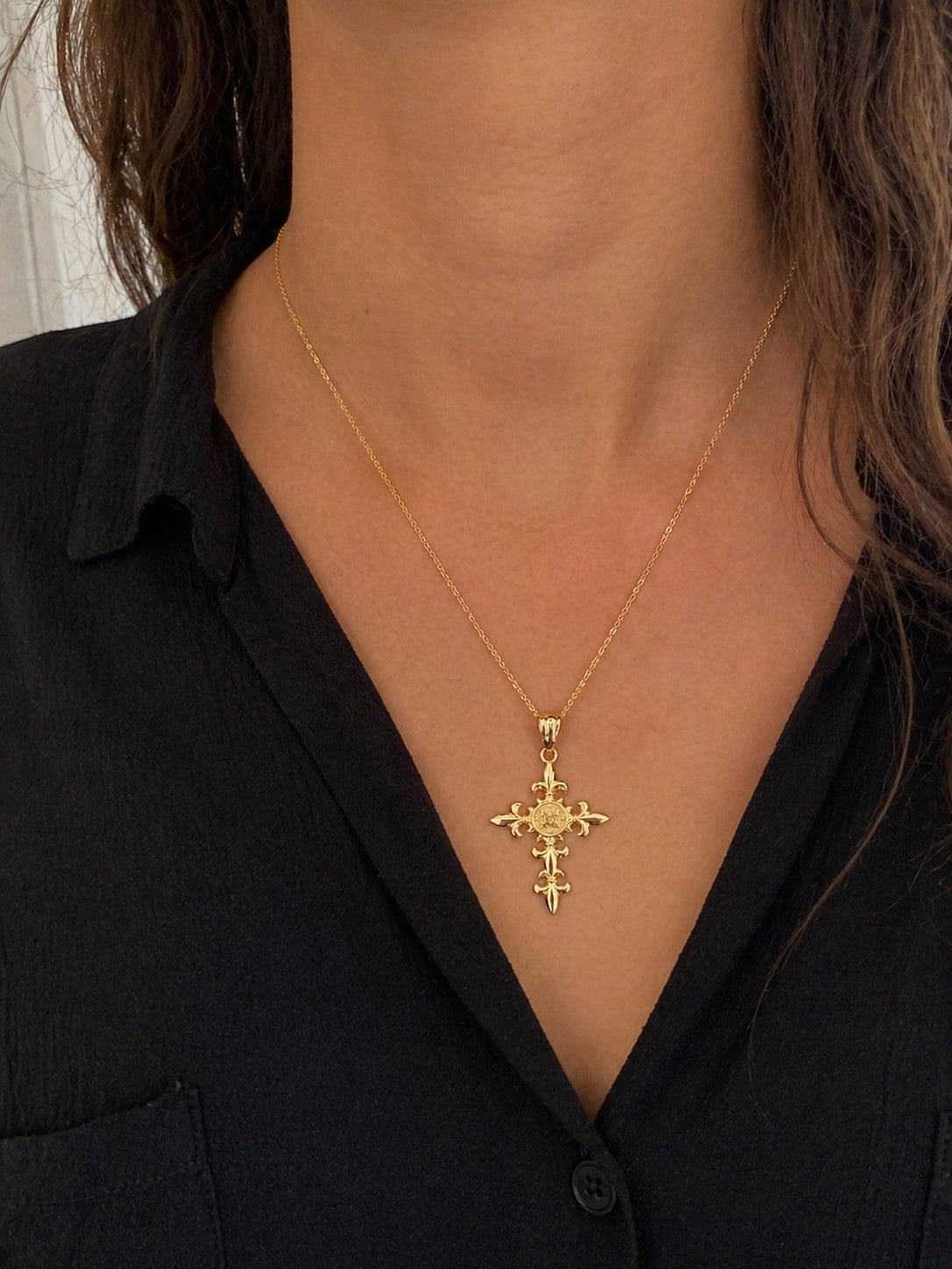 Karma Blingz yellow gold Fleur De Lis cross pendant necklace with polished finish and textured center detail on a delicate rolo chain.