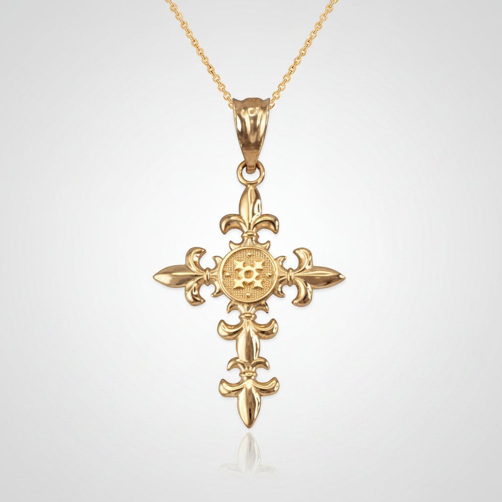Karma Blingz yellow gold fleur de lis cross pendant necklace with polished finish and textured center detail.