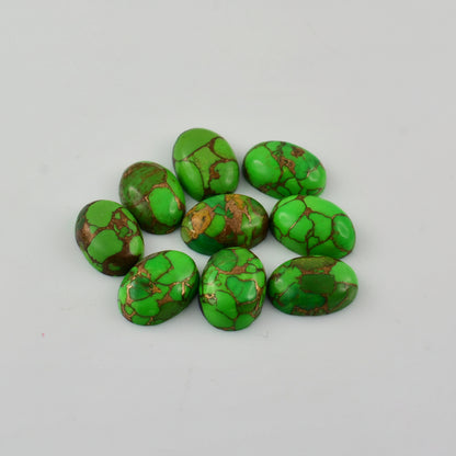 Nine polished green stone cabochons with brown and gold matrix veining, arranged in a small cluster on a light gray background.